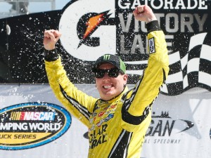 Kyle Busch celebrates in victory lane after winning Saturday's NASCAR Camping World Truck Series race at Michigan International Speedway.  Photo by Brian Lawdermilk/NASCAR via Getty Images