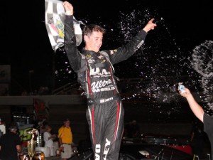 Zane Smith celebrates after winning Saturday night's PASS South Super Late Model feature at South Boston Speedway.  Photo by Laura / LWpictures.com