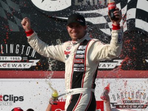 Denny Hamlin celebrates in victory lane after winning Saturday's NASCAR Xfinity Series race at Darlington Raceway. Photo by Sarah Crabill/NASCAR via Getty Images