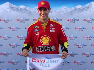 Joey Logano poses with the Coors Light Pole Award after qualifying for on the pole for Saturday night's NASCAR Sprint Cup Series race at Richmond International Raceway.  Photo by Matt Sullivan/Getty Images