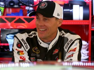 Kevin Harvick stands in the garage area during practice for Sunday's NASCAR Sprint Cup Series race at Chicagoland Speedway. Photo by Sarah Crabill/NASCAR via Getty Images