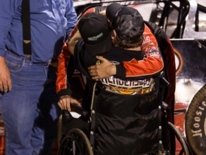 Duayne “Hollywood” Hommel gives winner Matt Henderson a hug in victory lane Saturday night after Henderson drove a car in honor of Hommel to the NeSmith Chevrolet Dirt Late Model Series win at I-75 Raceway. Photo by Scott Miller