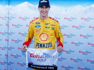 Joey Logano poses with the Coors Light Pole Award after qualifying for pole position for Sunday's NASCAR Sprint Cup Series race at Martinsville Speedway.  Photo by Brian Lawdermilk/NASCAR via Getty Images