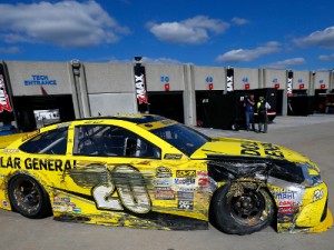 Matt Kenseth pulls into the garage in his damaged car during Sunday's NASCAR Sprint Cup Series race at Charlotte Motor Speedway.  Photo by Jonathan Ferrey/Getty Images