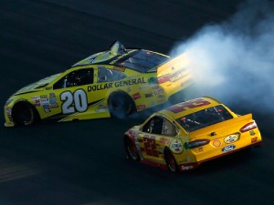 Matt Kenseth (20) spins after contact from Joey Logano (22) during Sunday's NASCAR Sprint Cup Series race at Kansas Speedway.  Logano went on to score the victory, while Kenseth finished 14th.  Photo by Todd Warshaw/Getty Images