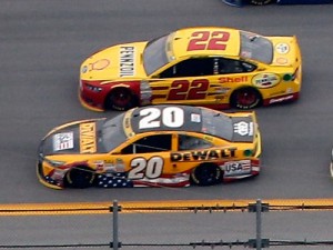 Matt Kenseth (20) and Joey Logano (22) race side-by-side during Sunday's NASCAR Sprint Cup Series race at Talladega Superspeedway. Tempers flared between the two for the second time in as many weeks during the first round of green flag pit stops. Photo by Brian Lawdermilk/Getty Images