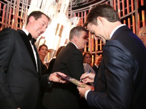 NASCAR Sprint Cup Series Champion Kyle Busch (left) gets an autograph from Jeff Gordon (right) during the 2015 NASCAR Sprint Cup Series Awards Show Friday night in Las Vegas.  Photo by Sean Gardner/NASCAR via Getty Images