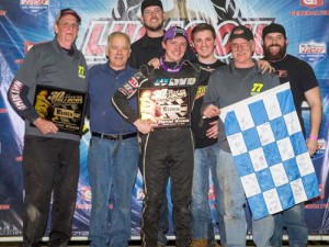 Alex Bright celebrates with his team in victory lane after scoring the win in Tuesday night's A-Feature to open the 2016 Chili Bowl Nationals at Tulsa Expo Raceway. Photo by Patrick Grant