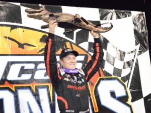 Brad Sweet hoists the "Big Gator" after winning Sunday night's DIRTcar Nationals World of Outlaws Craftsman Sprint Car Series feature at Volusia Speedway Park.  Photo: DIRTcar Nationals Media