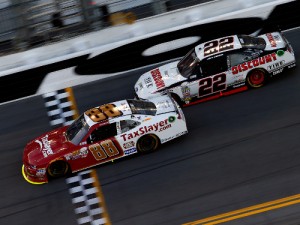 Chase Elliott (88) beats Joey Logano (22) to the finish line to score the win Saturday's NASCAR Xfinity Series race at Daytona International Speedway.  Photo by Jonathan Ferrey/Getty Images