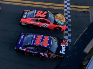 Denny Hamlin (11) nips Martin Truex, Jr. (78) at the finish line to give Toyota its first Daytona 500 victory.  Photo by Chris Trotman/NASCAR via Getty Images