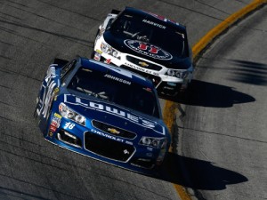 Jimmie Johnson (48) leads Kevin Harvick (4) during Sunday's NASCAR Sprint Cup Series Folds of Honor QuikTrip 500 at Atlanta Motor Speedway.  Johnson went on to score the win in an Overtime finish.  Photo by Jeff Zelevansky/Getty Images