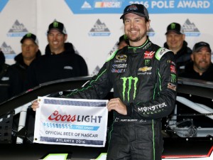 Kurt Busch poses with the Coors Light Pole Award inheriting the pole position for Sunday's NASCAR Sprint Cup Series race at Atlanta Motor Speedway. Kurt was moved to the pole after his brother, Kyle Busch, failed post-qualifying tech after posting the fastest lap in qualifying. Photo by Matt Hazlett/Getty Images