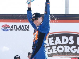 Kyle Busch celebrates after winning Saturday's NASCAR Xfinity Series race at Atlanta Motor Speedway.  It marks his first series victory at AMS, and his 77th overall.  Photo by Jeff Zelevansky/Getty Images