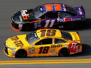 Kyle Busch (18) battles for position with Denny Hamlin (11) during Sunday's Daytona 500. Photo by Jonathan Ferrey/Getty Images