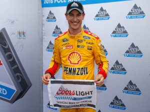 Joey Logano poses with the Coors Light Pole Award after qualifying for pole position for Sunday's NASCAR Sprint Cup Series STP 500 at Martinsville Speedway. Photo by Brian Lawdermilk/Getty Images