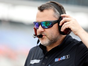 Team owner Tony Stewart stands on the grid during qualifying for Saturday's NASCAR Sprint Cup Series race at Texas Motor Speedway.  Photo by Ron Jenkins/Getty Images