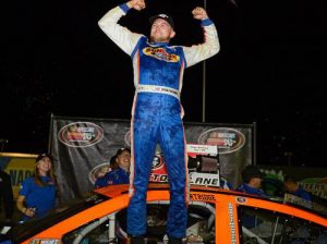 Ryan Partridge celebrates his first win of the season after he took home the trophy in Saturday night's NASCAR K&N Pro Series West race at Tucson Speedway. Photo by Jennifer Stewart/Getty Images for NASCAR