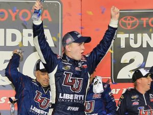 William Byron celebrates in victory lane after winning Friday night's NASCAR Camping World Truck Series race at Kansas Speedway.  Photo by Jerry Markland/Getty Images