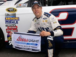 Brad Keselowski poses with the Coors Light Pole Award after qualifying on the pole for Sunday's NASCAR Sprint Cup Series race at Pocono Raceway.  Photo by Chris Trotman/NASCAR via Getty Images