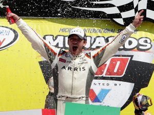 Daniel Suarez celebrates in victory lane after scoring his first NASCAR Xfinity Series victory Saturday afternoon at Michigan International Speedway.  Photo by Kena Krutsinger/Getty Images