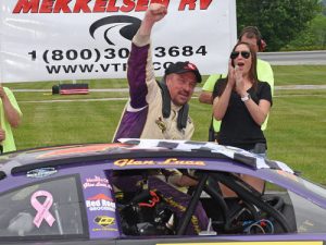 Glen Luce climbs from his car in victory lane after winning Sunday's PASS North Super Late Model Series race at Thunder Road International Speedbowl.  Photo by Norm Marx