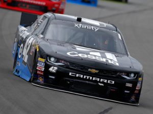 Kyle Larson races during Saturday's NASCAR Xfinity Series race at Pocono Raceway.  Larson would take the win by being the leader when the rains came, cutting the race short 47 laps short of the scheduled distance.  Photo by Todd Warshaw/Getty Images