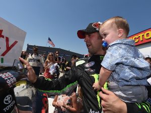 Sam Hornish, Jr. applies the winner's decal to his car in victory lane after winning Sunday's NASCAR Xfinity Series race at Iowa Speedway.  Photo by Rainier Ehrhardt/NASCAR via Getty Images