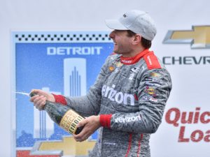 Will Power sprays the champagne on the podium following his win in Race 2 of the Chevrolet Dual in Detroit at Belle Isle Park.  Photo by Chris Owens