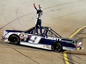 William Byron celebrates after winning Saturday night's NASCAR Camping World Truck Series race at Iowa Speedway.  Photo by Jonathan Moore/NASCAR via Getty Images