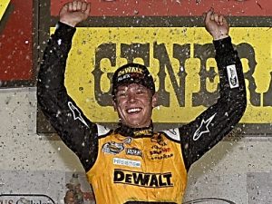 Erik Jones celebrates in victory lane after winning Saturday night's NASCAR Xfinity Series race at Iowa Speedway.  Photo by Jonathan Moore/NASCAR via Getty Images