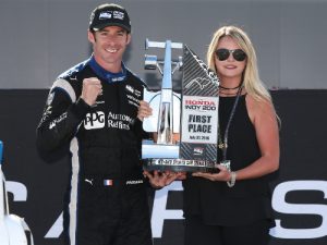 Simon Pagenaud and his girlfriend, Hailie, celebrate in Victory Circle after winning Sunday's Honda Indy 200 at Mid-Ohio for the Verizon IndyCar Series.  Photo by Chris Jones