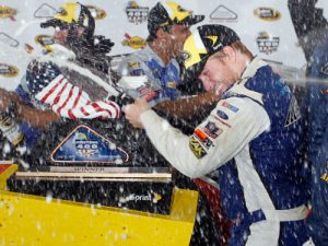 Chris Buescher celebrates in Victory Lane after winning Monday's rain delayed NASCAR Sprint Cup Series race at Pocono Raceway.  Photo by Brian Lawdermilk/Getty Images