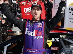 Denny Hamlin celebrates in victory lane after winning Sunday's NASCAR Sprint Cup Series race at Watkins Glen International.  Photo by Jonathan Ferrey/NASCAR via Getty Images 