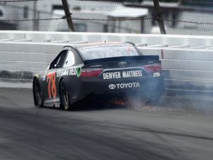 Martin Truex, Jr. hits the wall during Monday's rain delayed NASCAR Sprint Cup Series race at Pocono Raceway.  Truex, who started on the pole, ended his day in 38th place.  Photo by Josh Hedges/Getty Images