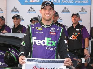 Denny Hamlin poses with the Coors Light Pole Award after qualifying for pole position for Saturday night's NASCAR Sprint Cup Series race at Richmond International Raceway.  Photo by Matt Sullivan/NASCAR via Getty Images