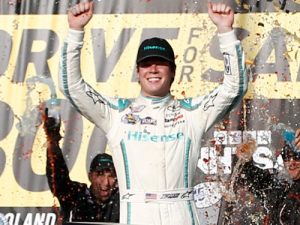 Erik Jones celebrates in victory lane after winning Saturday's NASCAR Xfinity Series race at Chicagoland Speedway.  Photo by Jeff Zelevansky/NASCAR via Getty Images