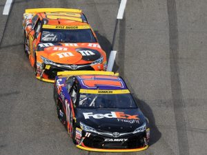 Denny Hamlin (11) leads Kyle Busch (18) during Sunday's NASCAR Sprint Cup Series race at Martinsville Speedway.  Photo by Daniel Shirey/Getty Images