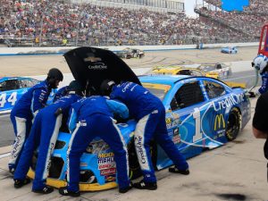 Jamie McMurray's pit crew work on his Chevrolet during Sunday's NASCAR Sprint Cup Series race at Dover International Speedway. McMurray and his Chip Ganassi Racing teammate Kyle Larson were eliminated from the NASCAR Championship Chase in the event. Photo by Chris Trotman/Getty Images