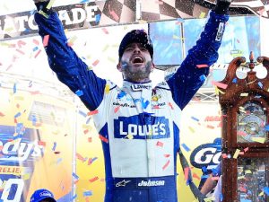 Jimmie Johnson celebrates in victory lane after winning Sunday's NASCAR Sprint Cup Series race at Martinsville Speedway.  Photo by Chris Trotman/NASCAR via Getty Images