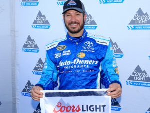 Martin Truex, Jr. poses with the Coors Light Pole Award after qualifying on the pole position for Sunday's NASCAR Sprint Cup Series race at Martinsville Speedway.  Photo by Chris Trotman/NASCAR via Getty Images