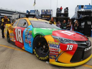 Crew members push the car of Kyle Busch in the garage area during Friday's practice for the NASCAR Sprint Cup Series race slated for Sunday at Texas Motor Speedway.  Photo by Sarah Crabill/Getty Images