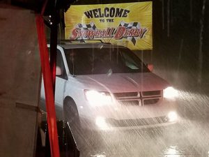 Vehicles exit 5 Flags Speedway Sunday night as heavy rains moved through the Pensacola, Florida area, washing out the 49th annual Snowball Derby.  The asphalt Super Late Model race is now slated to run Monday afternoon.  Photo by Eddie Richie/Turn One Photos/Loxley, AL